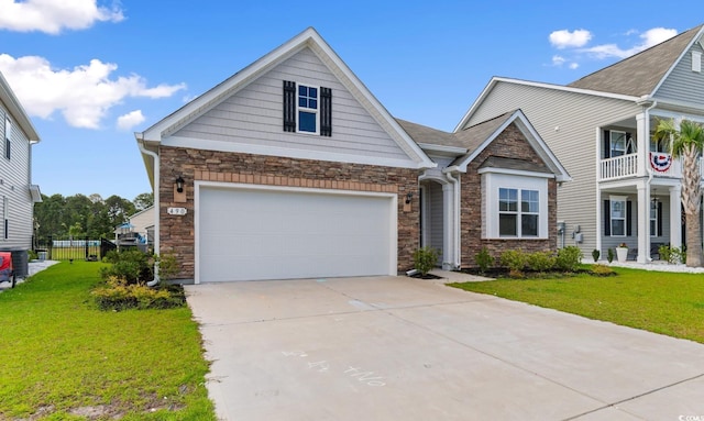 490 Calhoun Falls Dr, Myrtle Beach, SC 29579 - view of front of home featuring stone siding, concrete driveway, a front yard, and a garage