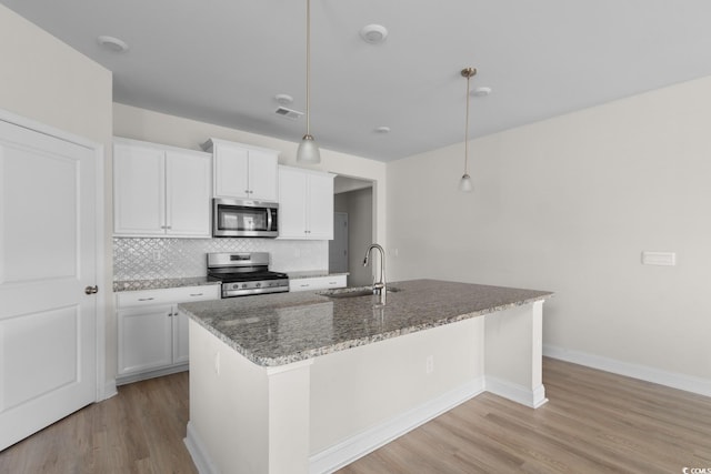 490 Calhoun Falls Dr, Myrtle Beach, SC 29579 - kitchen with stainless steel appliances, tasteful backsplash, light wood finished floors, and stone counters