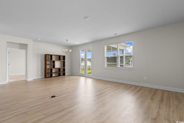 490 Calhoun Falls Dr, Myrtle Beach, SC 29579 - unfurnished living room featuring a chandelier and light wood-style flooring