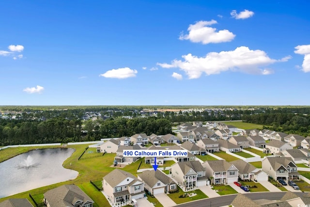 490 Calhoun Falls Dr, Myrtle Beach, SC 29579 - aerial perspective of suburban area with a large body of water and a tree filled landscape