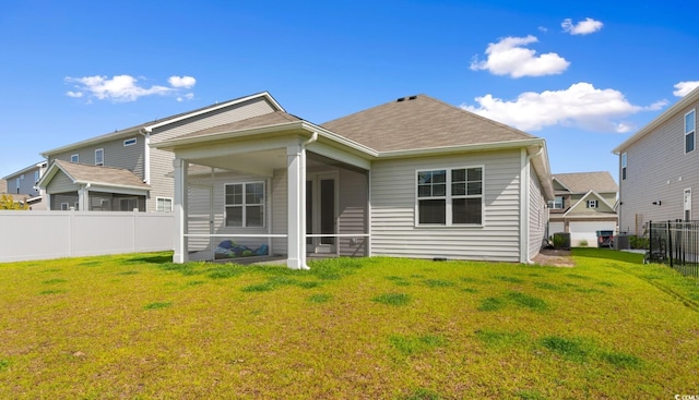 490 Calhoun Falls Dr, Myrtle Beach, SC 29579 - rear view of house featuring a sunroom and roof with shingles