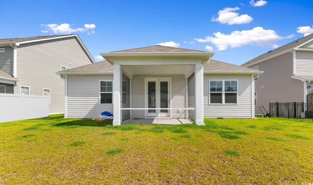 490 Calhoun Falls Dr, Myrtle Beach, SC 29579 - back of house featuring a sunroom and roof with shingles