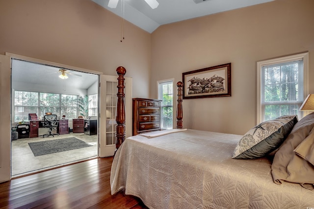 1010 Swan Lake Dr, North Myrtle Beach, SC 29582 - bedroom featuring wood finished floors, multiple windows, a desk, ceiling fan, and high vaulted ceiling