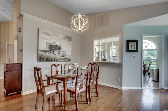 1010 Swan Lake Dr, North Myrtle Beach, SC 29582 - dining area with a chandelier and wood finished floors