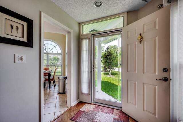 1010 Swan Lake Dr, North Myrtle Beach, SC 29582 - foyer entrance with a textured ceiling and baseboards