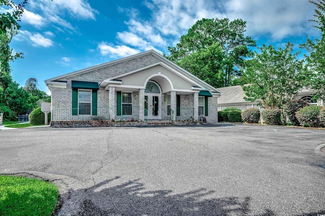 1010 Swan Lake Dr, North Myrtle Beach, SC 29582 - view of front facade featuring brick siding and a porch