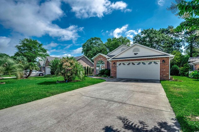 1010 Swan Lake Dr, North Myrtle Beach, SC 29582 - view of front facade featuring brick siding, concrete driveway, a front lawn, and a garage