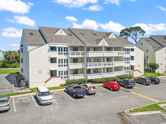 1100 Possum Trot Rd Unit F218, North Myrtle Beach, SC 29582 - view of building exterior featuring uncovered parking
