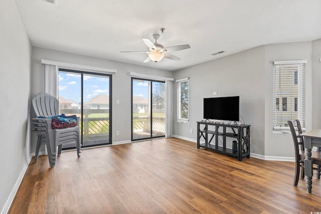 1100 Possum Trot Rd Unit F218, North Myrtle Beach, SC 29582 - living area featuring healthy amount of natural light, ceiling fan, and wood finished floors