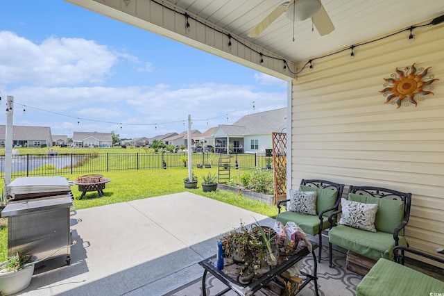 227 Palm Terrace Loop, Conway, SC 29526 - fenced backyard with a patio area, a residential view, ceiling fan, and an outdoor living space with a fire pit