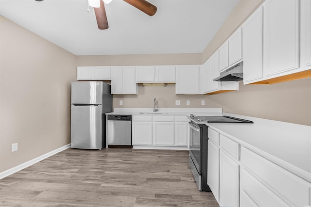 178 Beaver Pond Loop Unit 60, Pawleys Island, SC 29585 - kitchen featuring stainless steel appliances, under cabinet range hood, a ceiling fan, and white cabinetry
