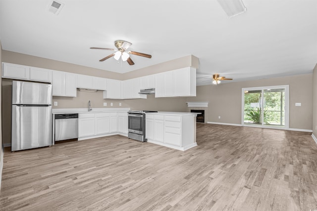 178 Beaver Pond Loop Unit 60, Pawleys Island, SC 29585 - kitchen featuring appliances with stainless steel finishes, ceiling fan, under cabinet range hood, and open floor plan