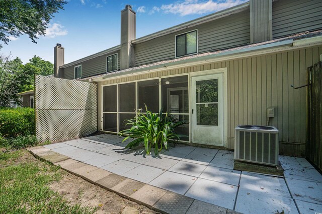178 Beaver Pond Loop Unit 60, Pawleys Island, SC 29585 - rear view of property with a patio area and a sunroom