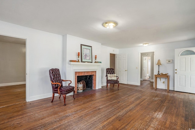 602 3rd Ave N, Myrtle Beach, SC 29577 - living room featuring wood finished floors and a brick fireplace