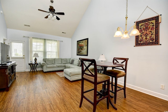 6172 Catalina Dr Unit 113, North Myrtle Beach, SC 29582 - living room with a ceiling fan, wood finished floors, a chandelier, and high vaulted ceiling