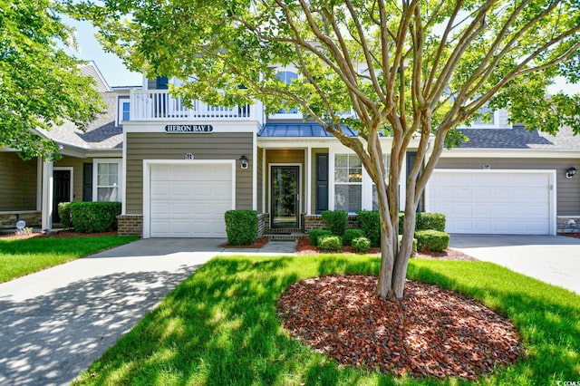 6172 Catalina Dr Unit 113, North Myrtle Beach, SC 29582 - view of front facade with driveway, a standing seam roof, and brick siding