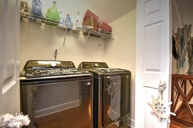 6172 Catalina Dr Unit 113, North Myrtle Beach, SC 29582 - laundry area with washing machine and clothes dryer and a textured ceiling