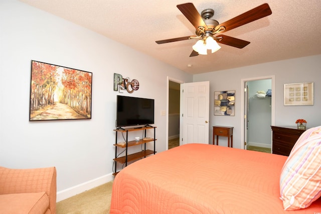 6172 Catalina Dr Unit 113, North Myrtle Beach, SC 29582 - bedroom with light carpet, a ceiling fan, and a walk in closet