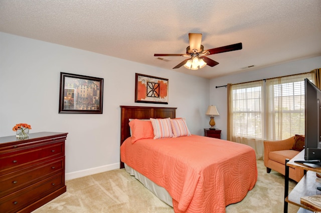 6172 Catalina Dr Unit 113, North Myrtle Beach, SC 29582 - bedroom with carpet floors, a textured ceiling, and a ceiling fan