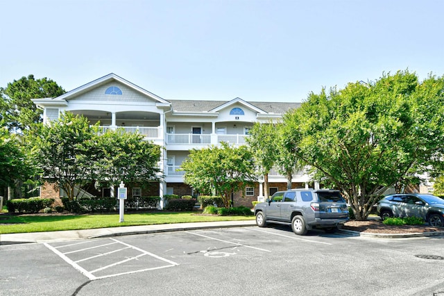 5825 Catalina Dr Unit 833, North Myrtle Beach, SC 29582 - view of building exterior with uncovered parking