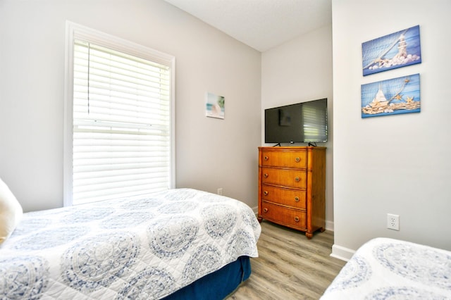 5825 Catalina Dr Unit 833, North Myrtle Beach, SC 29582 - bedroom featuring light wood-style floors and baseboards