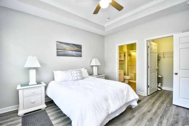 5825 Catalina Dr Unit 833, North Myrtle Beach, SC 29582 - bedroom featuring crown molding, wood finished floors, a walk in closet, ensuite bathroom, and a closet