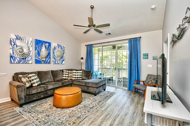 5825 Catalina Dr Unit 833, North Myrtle Beach, SC 29582 - living room with vaulted ceiling, wood finished floors, ceiling fan, and a textured ceiling