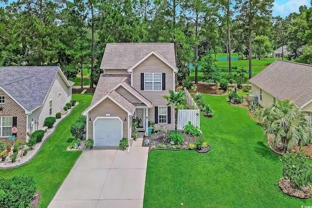 161 Barclay Dr, Myrtle Beach, SC 29579 - view of front facade featuring driveway, a front yard, and view of wooded area