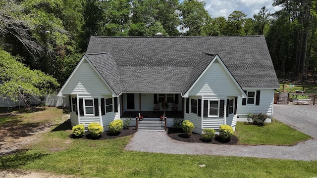 160 Comanche Dr, Georgetown, SC 29440 - victorian house featuring a sunroom and roof with shingles