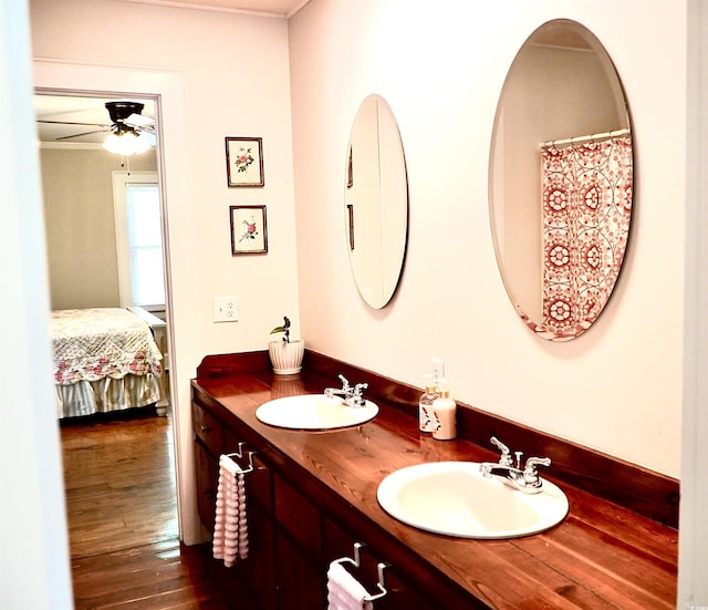 160 Comanche Dr, Georgetown, SC 29440 - full bathroom with ensuite bath, double vanity, ceiling fan, and wood finished floors