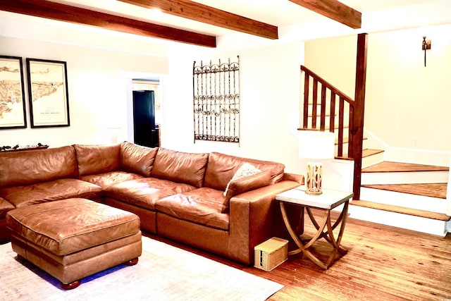 160 Comanche Dr, Georgetown, SC 29440 - living room featuring wood finished floors, beamed ceiling, and stairway