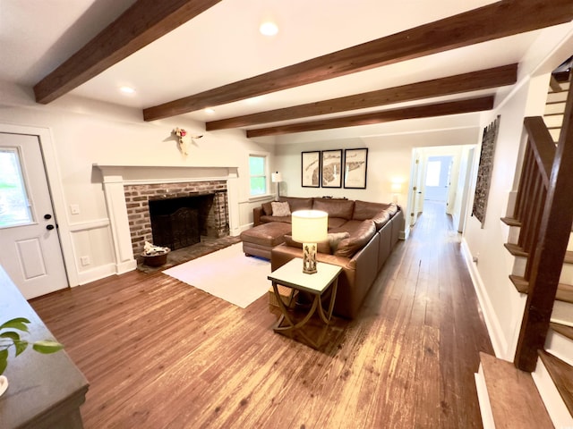 160 Comanche Dr, Georgetown, SC 29440 - living area featuring wood finished floors, stairs, a brick fireplace, beamed ceiling, and recessed lighting