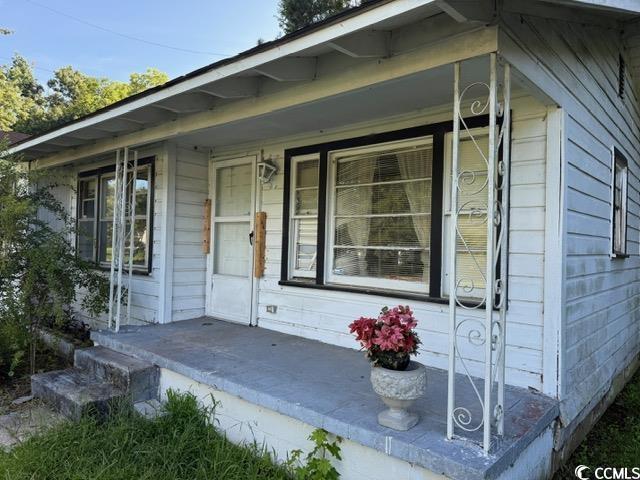 303 Leroy Bethea Rd, Mullins, SC 29574 - doorway to property with a porch