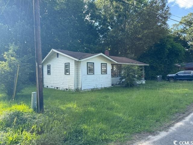 303 Leroy Bethea Rd, Mullins, SC 29574 - view of home's exterior featuring a yard