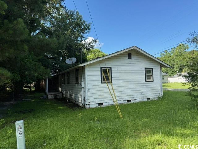 303 Leroy Bethea Rd, Mullins, SC 29574 - view of property exterior with crawl space and a lawn