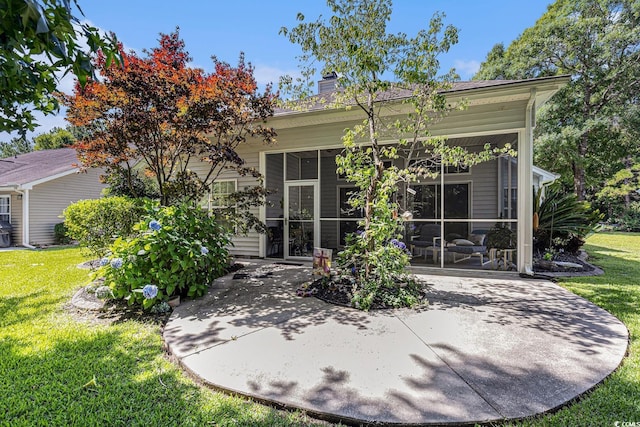 4610 Fringetree Dr, Murrells Inlet, SC 29576 - back of house featuring a lawn, a chimney, and a patio area