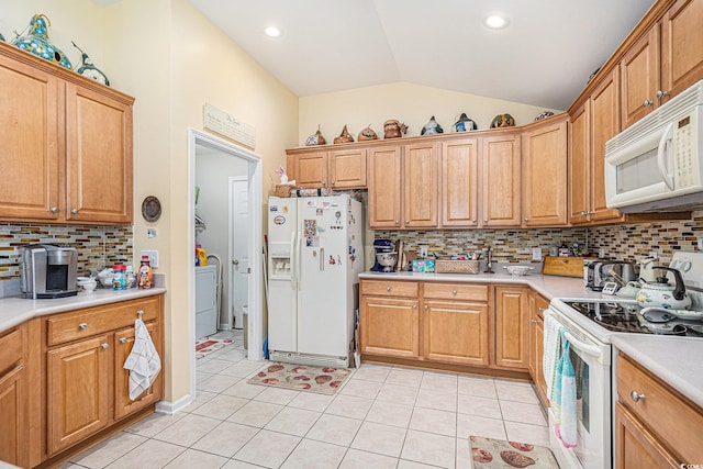 4610 Fringetree Dr, Murrells Inlet, SC 29576 - kitchen featuring white appliances, lofted ceiling, washer / clothes dryer, light countertops, and light tile patterned floors