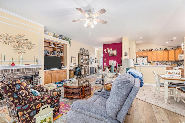 4610 Fringetree Dr, Murrells Inlet, SC 29576 - living room with ceiling fan, a brick fireplace, light wood-style floors, lofted ceiling, and recessed lighting