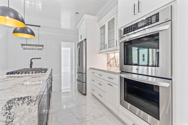 607 Boone Hall Dr, Myrtle Beach, SC 29579 - kitchen with appliances with stainless steel finishes, light marble finish floors, decorative backsplash, light stone countertops, and glass insert cabinets