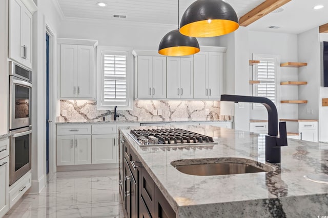 607 Boone Hall Dr, Myrtle Beach, SC 29579 - kitchen featuring stainless steel appliances, light marble finish flooring, hanging light fixtures, white cabinets, and decorative backsplash