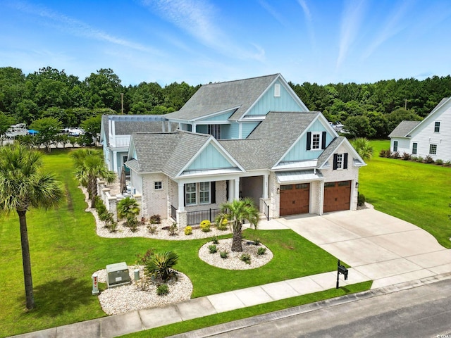 607 Boone Hall Dr, Myrtle Beach, SC 29579 - view of front facade featuring board and batten siding, a front yard, driveway, and covered porch