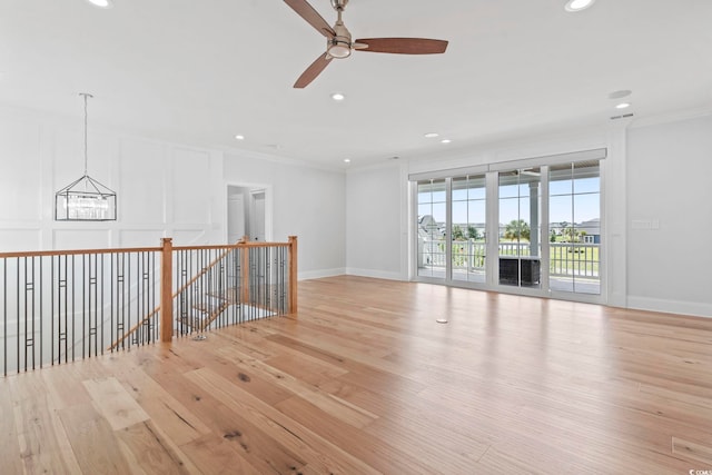 607 Boone Hall Dr, Myrtle Beach, SC 29579 - unfurnished room featuring crown molding, recessed lighting, a chandelier, a ceiling fan, and light wood-style flooring