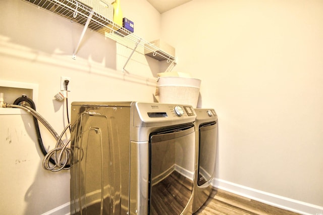 2325 Copper Creek Loop, Longs, SC 29568 - laundry room with separate washer and dryer and wood finished floors