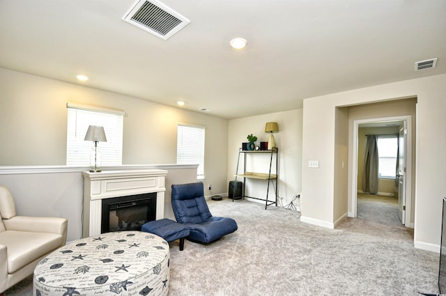 2325 Copper Creek Loop, Longs, SC 29568 - sitting room with carpet floors, recessed lighting, and a glass covered fireplace