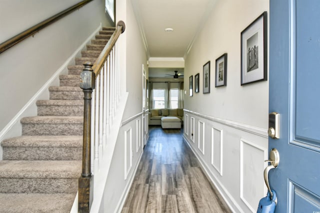 2325 Copper Creek Loop, Longs, SC 29568 - stairway featuring a ceiling fan, a decorative wall, wood finished floors, a wainscoted wall, and crown molding