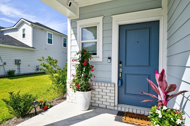 2325 Copper Creek Loop, Longs, SC 29568 - view of exterior entry featuring a lawn