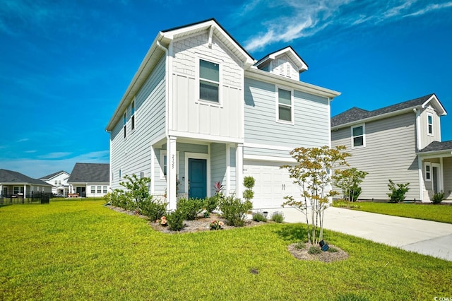 2325 Copper Creek Loop, Longs, SC 29568 - traditional-style home with an attached garage, driveway, a front yard, and board and batten siding
