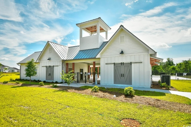 2325 Copper Creek Loop, Longs, SC 29568 - back of house with board and batten siding, a standing seam roof, and a metal roof
