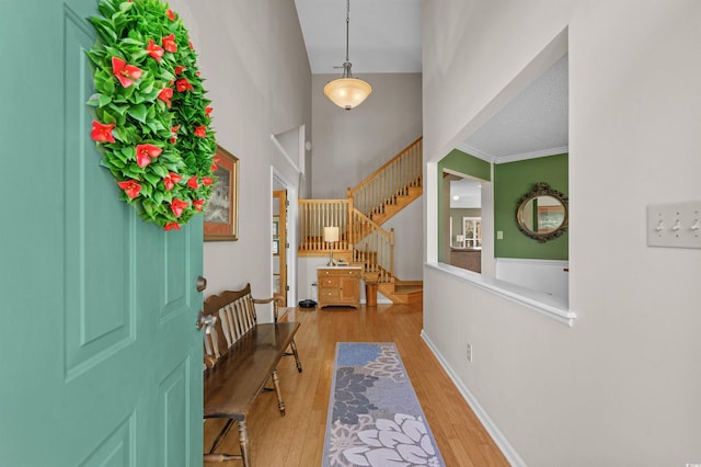 3975 River Hills Dr, Little River, SC 29566 - foyer with light wood-style floors, stairs, and a high ceiling