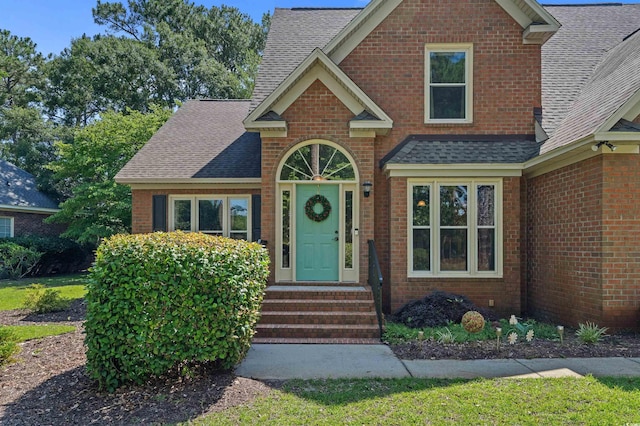 3975 River Hills Dr, Little River, SC 29566 - traditional-style home with a shingled roof, brick siding, and entry steps